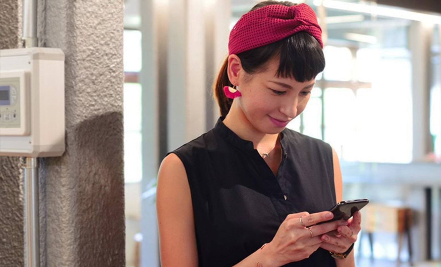 woman looking at a mobile phone