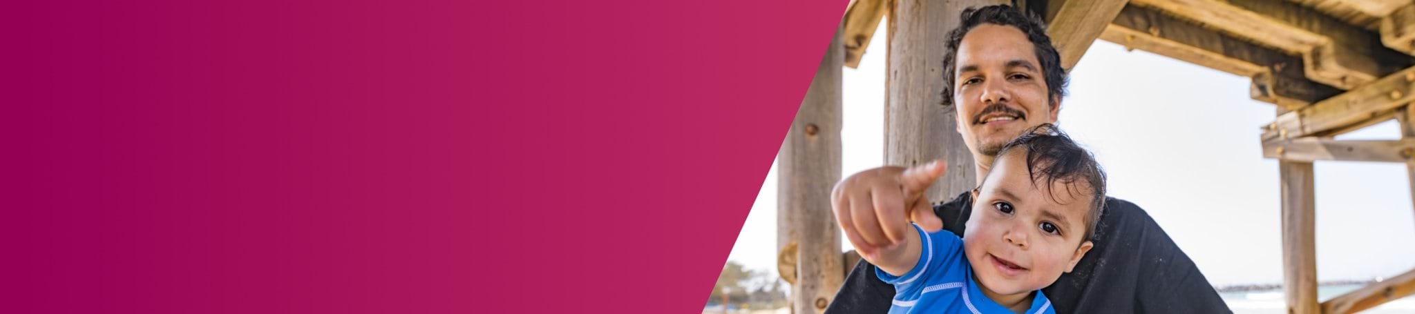 man and child under a pier