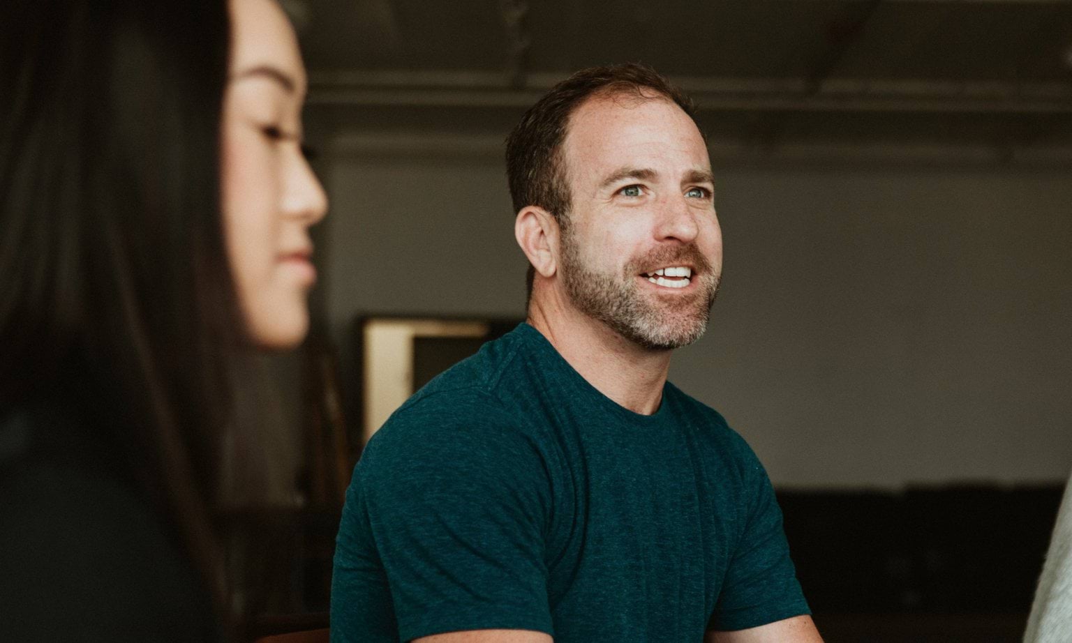 A person talking to a group of people