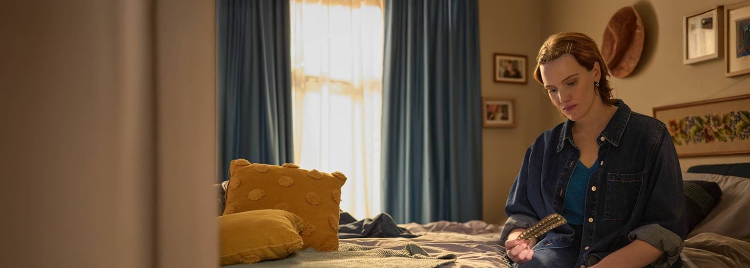 A person holding a pill packet