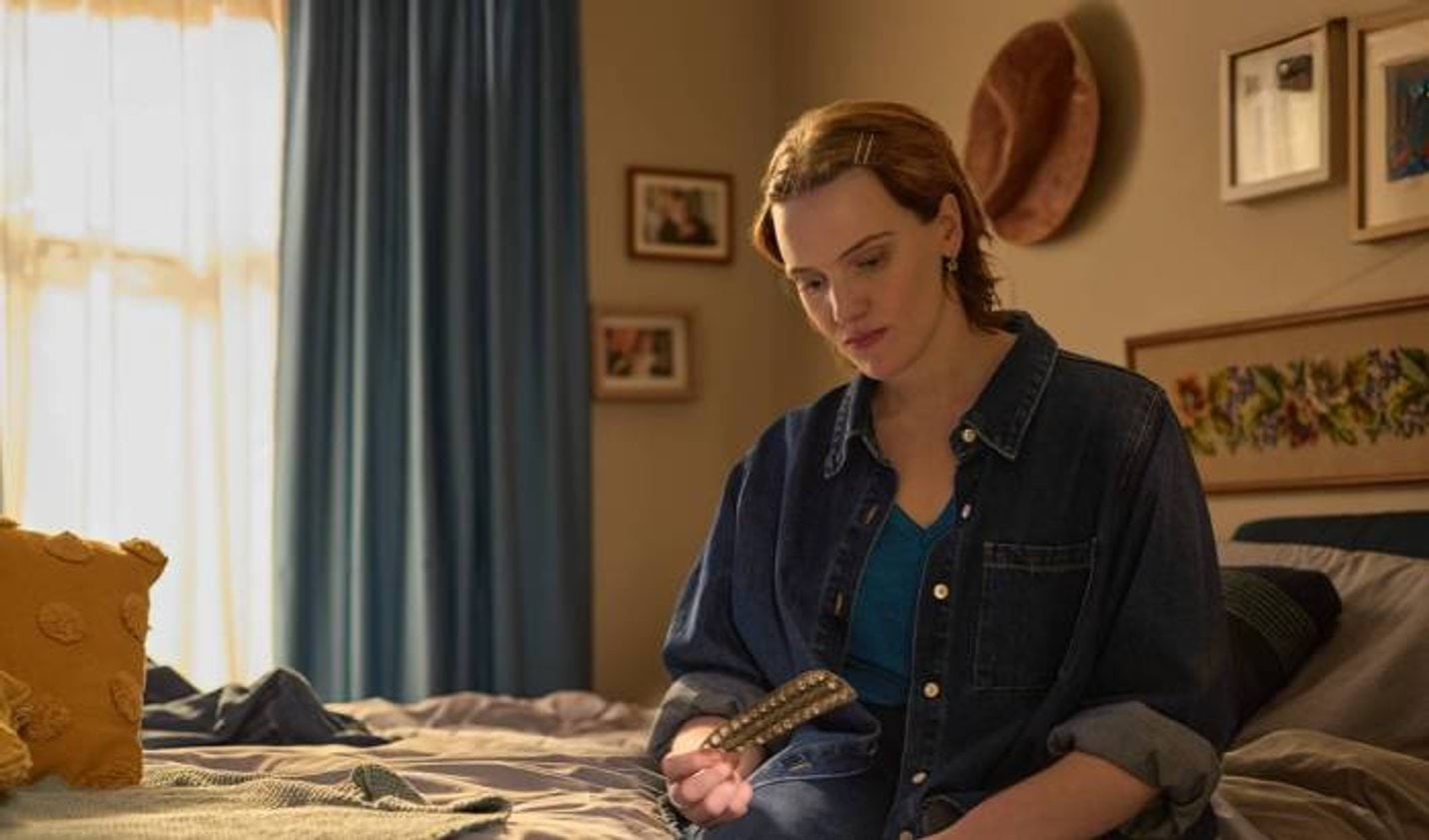 Chemist Care Now Campaign Banner A person sitting on a bed looking at an empty pill packet